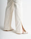 Detail off white stretch jeans side slit