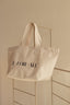 Beige colored tote bag